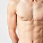 Male torso showing a flat, toned chest after gynecomastia surgery.